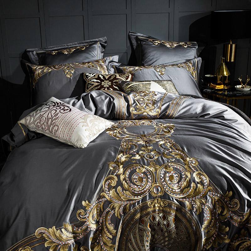 Luxurious Egyptian Cotton Sheets showcasing intricate gold embroidered patterns.