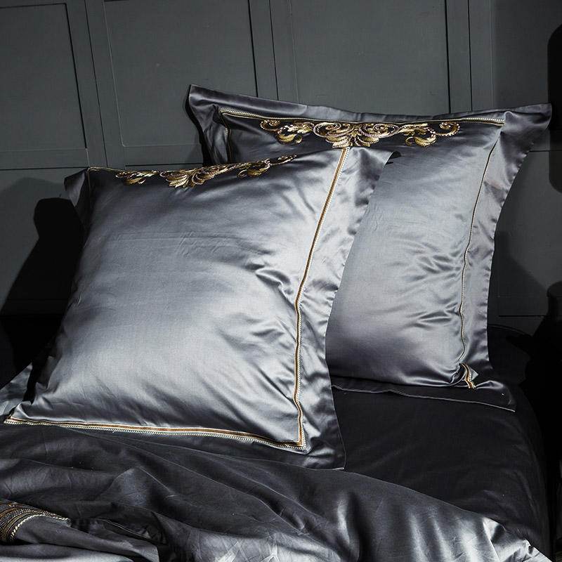 Embroidered pillow shams from the Egyptian Cotton Sheets set with detailed trim.