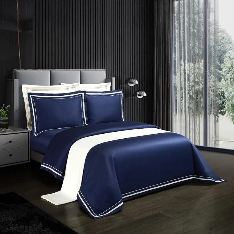 Luxury cotton sheets laid out on a bed in a beautifully designed bedroom