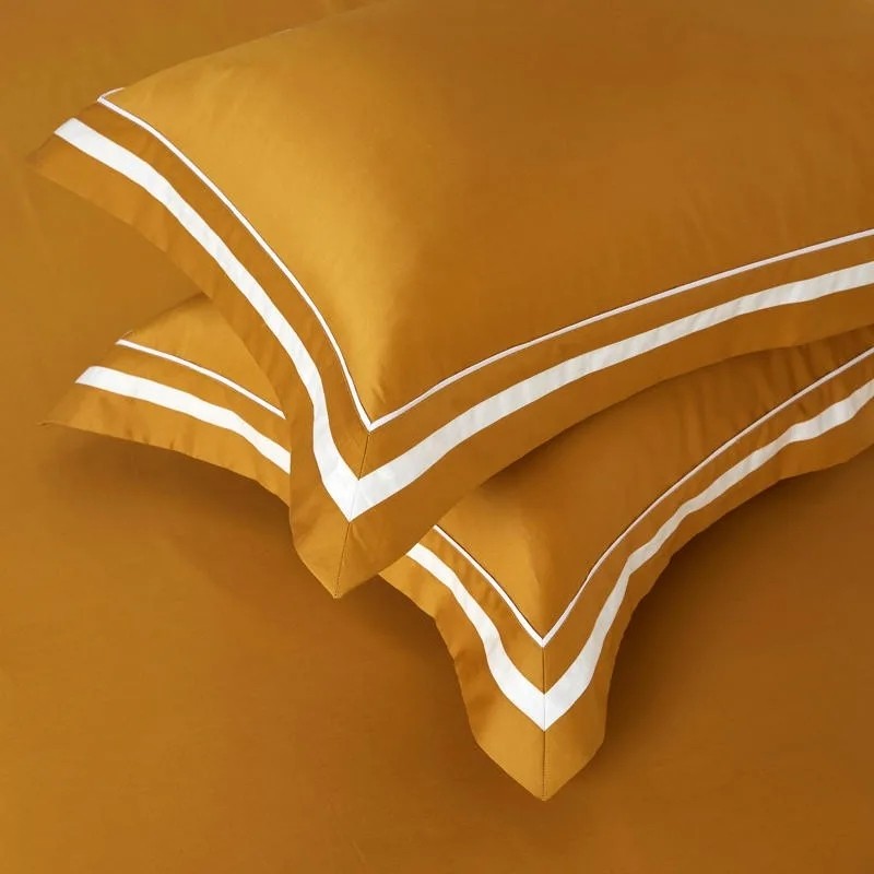 remium cotton bed sheets displayed on a stylish bed