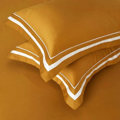 remium cotton bed sheets displayed on a stylish bed