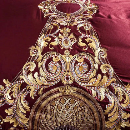 Red Egyptian Cotton Sheets pillow with baroque embroidery design, styled on a dark luxury bed.